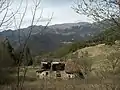 Mount Camiolo di Mezzo, in the foreground the ruins of the barn known as the Fabbrica, built in 1877 by Filippo Viani, in the background the barns known as the Pir