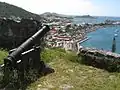 Canon, with view of Marigot Market and harbor below