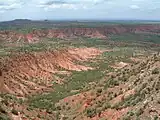 Side canyon carved by erosion.