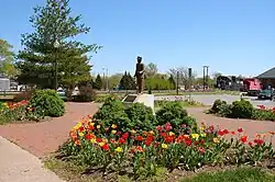 This statue was placed here by Station Carbondale, Inc. through donations from people dedicated to the preservation of Carbondale's railroad history. The first train came to Carbondale on July 4, 1854. At the peak of the city's railroad traffic, as many as 53 passenger trains passed through here each day.