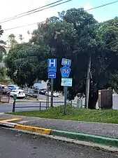 PR-719 north approaching PR-156 junction in downtown Barranquitas