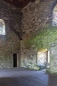 The keep interior looking south-west. A shadow halfway up the left wall marks the position of the original roof.