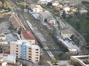 View of the station. On the left side of the picture, the abandoned FS tracks and building. On the right side, the FC station building and tracks.