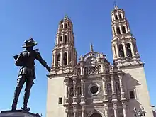 Image 20Chihuahua Cathedral and a monument to the city's founder, Antonio Deza y Ulloa (from History of Mexico)