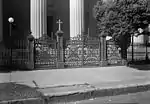 Cast iron gates and fence on east front.