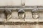 Human heads on the external part belong to unknown individuals