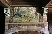 Fireplace decoration depicting a wolf hunt in the castle of Pibrac (France).