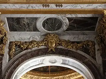 Baroque festoon with a mascaron in the Hall of Mirrors of the Palace of Versailles, Versailles, France, designed by Jules Hardouin-Mansart, 1678-1684