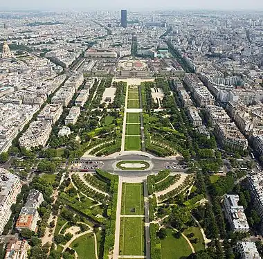 Image 11Champ de MarsPhoto credit: David IliffChamp de Mars (Paris, France), as seen from the observation deck of the Eiffel Tower. In the distance is Tour Montparnasse and the dome on the left is Les Invalides. The École Militaire is at the end of the Champ de Mars. In English the name means "Field of Mars", from Mars the Roman god of war, from its original use for military training. During the French Revolution, the Champ de Mars was the setting of the Fête de la Fédération, on 14 July 1790.More selected pictures