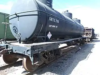 The G.R.Y.X. 799 tank Car is a three dome, three compartment, outside riveted tank car which was built for the John H. Grace Company in 1938. The three separate compartments were used to carry chemicals or solvents.