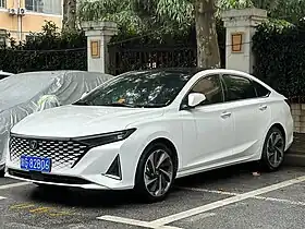 Front three-quarter view of a front-engined four-door car.