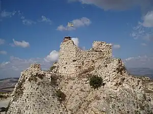 rugged rocky peak with stones and the remains of a tower