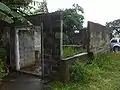 The cinderblock building that is left on the site.