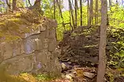 The now damaged granite block eastern and western abutments  that were part of the Falling Creek Railroad Bridge of the Chesterfield Railroad.