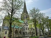 This picture of Chichester Cathedral shows the Norman windows of the Nave clerestory, the Early English windows of the tower, the Geometric windows of the aisles and the large Perpendicular window of the transept. The spire is a Victorian restoration.