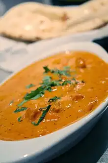 Chicken tikka masala, adapted from Indian chicken tikka and called "a true British national dish." The dish is now popular staple in Indian restaurants worldwide.