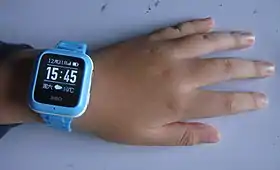 Child wearing a smartwatch