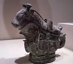 Ritual wine server (guang); 1100 BC; 21 × 22.9 cm (8.25 × 9 in); Indianapolis Museum of Art (Indiana, U.S.). Adorning the surface of the vessel are three primary decorative animal motifs, including fifteen imaginary creatures cast in relief along the sides