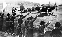 Japanese high school girls wave farewell to a kamikaze pilot departing to Okinawa