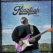 Christone "Kingfish" Ingram, playing a purple and white electric guitar