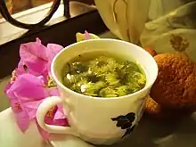  Chrysanthemum blossoms steep in a cup of hot water