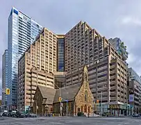 The church building, with high-rises behind it