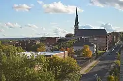 The skyline of Churchill, with the prominent steeple of the Sacred Heart Church, the neighborhood's namesake