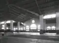 Interior of the market, circa 1945, showing the large brick pillars supporting the building, as well as the tiled floor, which had a Greek key border