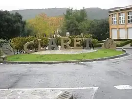 Sculpture made by a local craftsman in local quarry stone at the entrance of the village, before the bridge over the Brestalou. In the background is the Crête de Taillade.