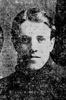 Black and white photo of a man in his early twenties wearing a hockey sweater