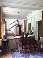 Foyer. The pine flooring of the house is of high tar content and thought to be termite resistant.