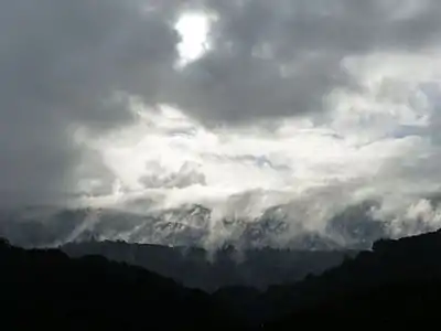 Storm clearing over hillside