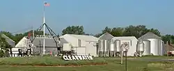 Grain bins and welcome signs at northern edge of Clearwater