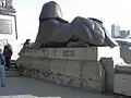 One of two sphinxes at the base of London's Cleopatra's Needle. The scars on the pedestal were from fragments of a bomb dropped close to this spot, during a World War I airstrike.