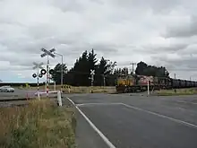 Coal train approaching level crossing