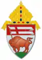 The arms of the Diocese of Buffalo: The arms feature an American bison, colloquially called a buffalo, carrying a banner of the Cross of St. George (analogous to the heraldic Lamb of God), referencing the name of city in which the see is based, Buffalo, New York.