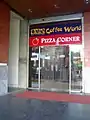 A co-branded Coffee World Pizza Corner outlet on Road 4A