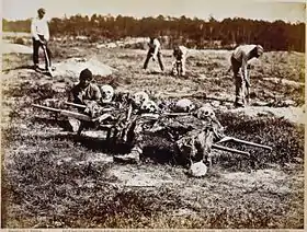 "African Americans collecting bones of soldiers killed at Cold Harbor (by John Reekie; issued as Stero #918, April 1865). Note part of a series: