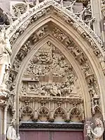 Adoration of the Magi on a tympanum on Saint-Thiébaut Church, Thann, France.