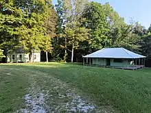 Collins home (left) and 2nd cave ticket booth (right)