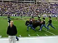 Ralphie IV running at the game against the Kansas State Wildcats on November 4, 2006. Notice the "BEAT KSU" on Ralphie's outfit. The handlers often lose their cowboy hats.