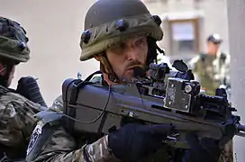 Slovenian soldiers provide security with an F2000 S while conducting a room clearance exercise during exercise Combined Resolve II at the Joint Multinational Readiness Center in Hohenfels, Germany 22 May 2014.