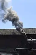 Historical steam locomotive passing by the Régua Railway Station, 2012