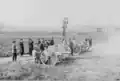 Spanish commission examining 2 different 75-mm light field guns on the Harfleur range, 1904