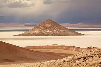 Cono de Arita, a conical sandstone inselberg in the middle of Salar de Arizaro, Argentina.