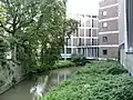 Jeker river passing buildings of Music Conservatorium at Maastricht