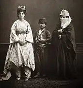 Studio portrait of models wearing traditional clothing from Istanbul, Ottoman Empire