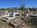 Graves at the Continental Cemetery with the Santa Rita Mountains in the background