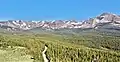 Looking west to the Continental Divide. Left to rightː Navajo Peak, Apache Peak, Shoshoni Peak, Pawnee Peak (centered), Mount Toll, Mount Audubon.