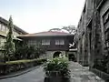 Convento entrance and southeastern flank of the shrine, facing southwest